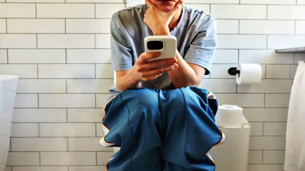 using phone in toilet