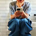 using phone in toilet